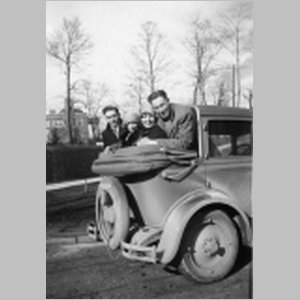Floyd,_Emily,_Mary,_and_Mervin_in_drop-bonnet_car,_no_date.html